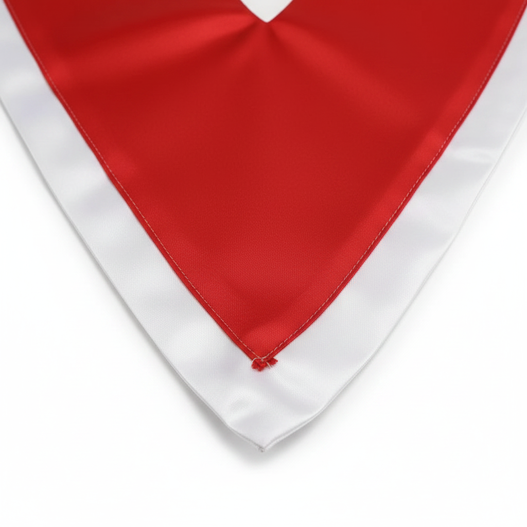 Close-up detail of red and white two-tone V-stole showing sharp V-point and satin texture, white background